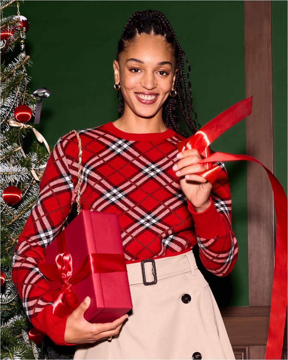 Exclusive capsule. Luxurious knits, accessories, and more in a festive red check you will only find here.
