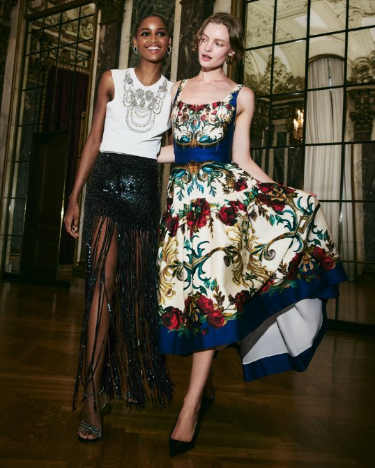 2 women in party dresses.