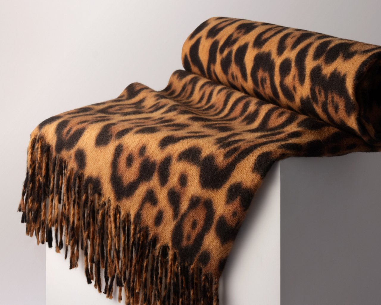 Free leopard print scarf with any beauty purchase of $250 or more. Ends October 26, while supplies last.