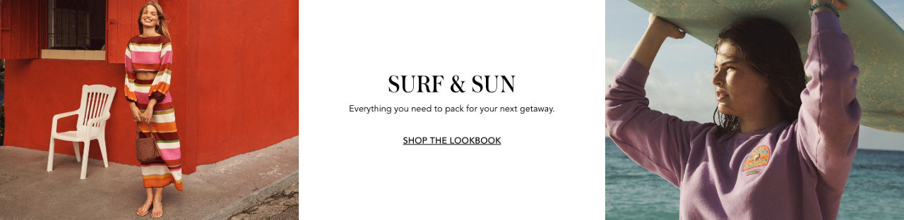 2 photos, 1st of female model outside a red wood building, in a matching brown, white, pink, and red striped long sleeve cutoff top and long skirt, 2nd of female model in a purple sweatshirt on the beach, holding a surfboard over her head.