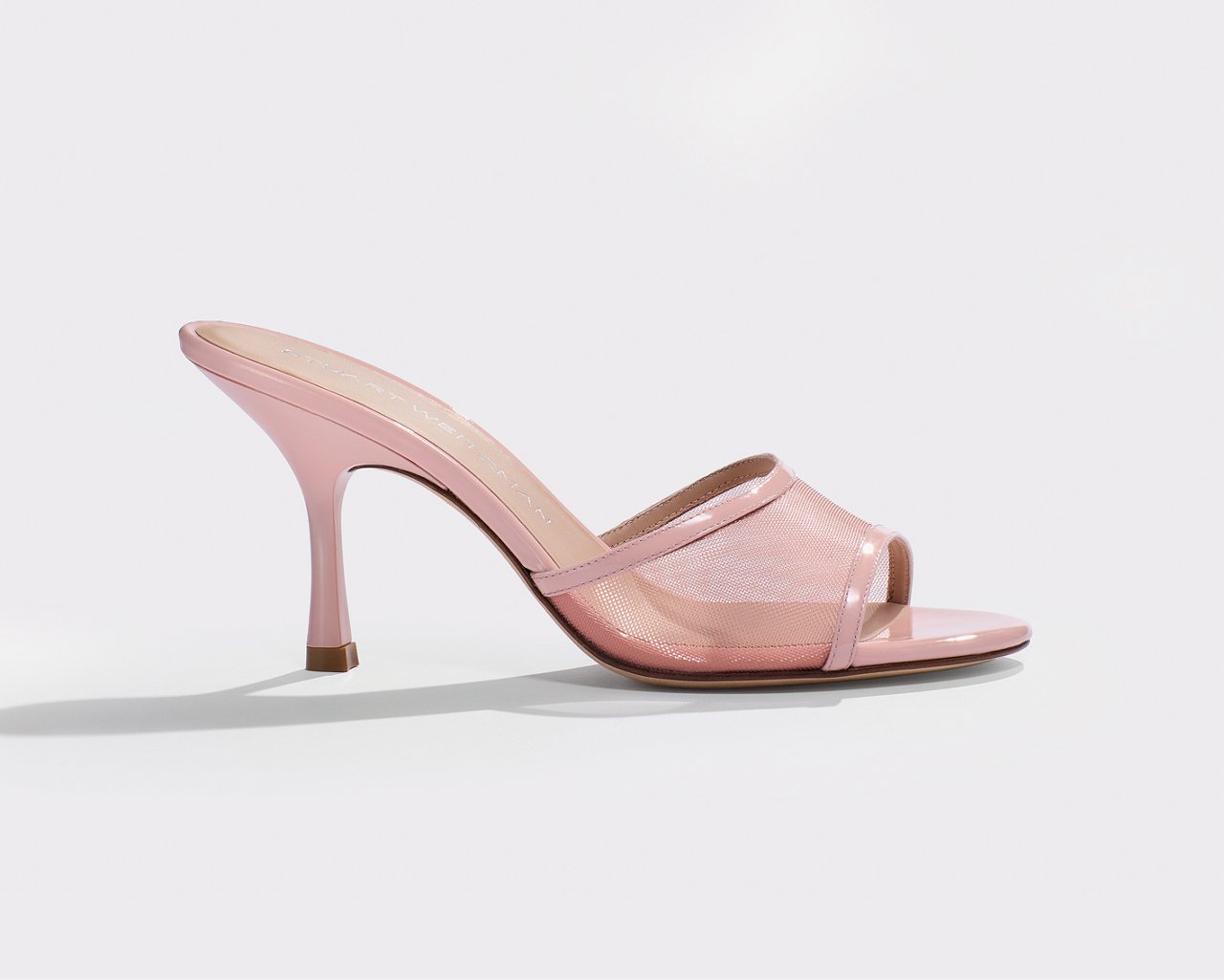 A single Stuart Weitzman pink high heel sandal. Pastel season, Stuart Weitzman.