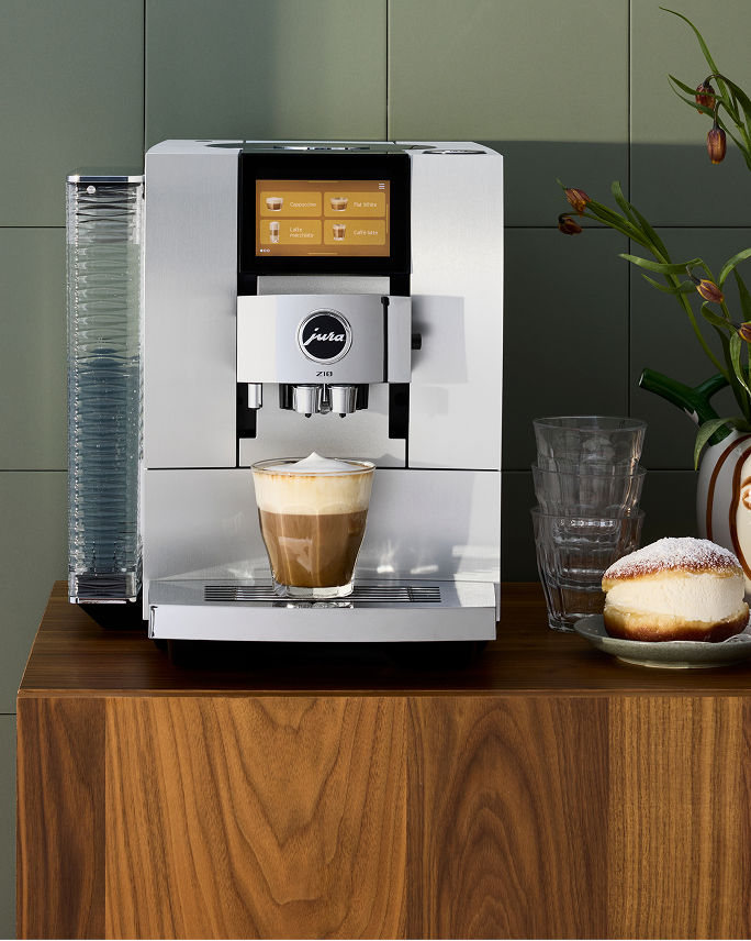 A silver Jura coffee maker. Shop coffee.