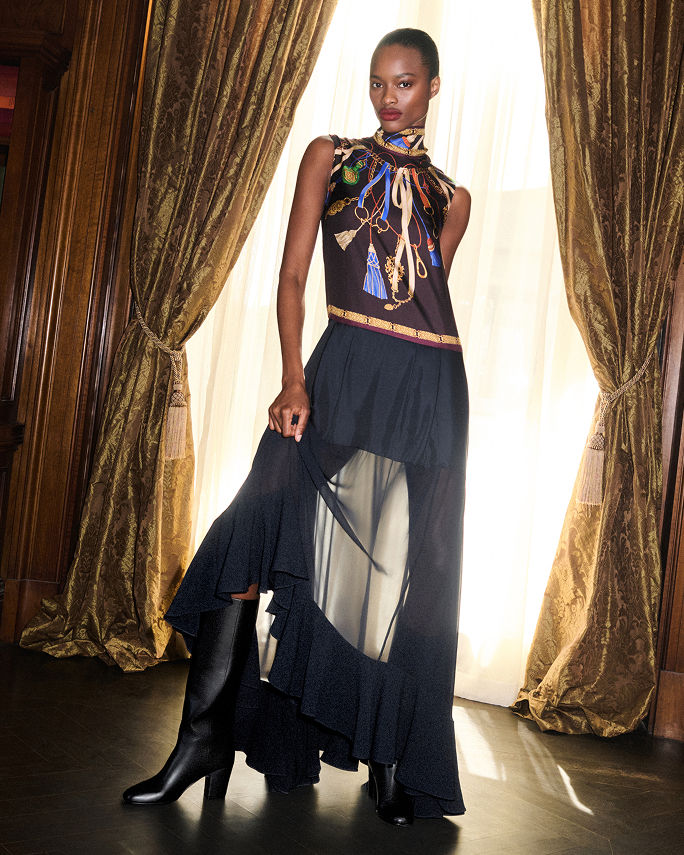 A woman in a tiered, flowy Etro halter dress with printed top. The fall collections, Etro.