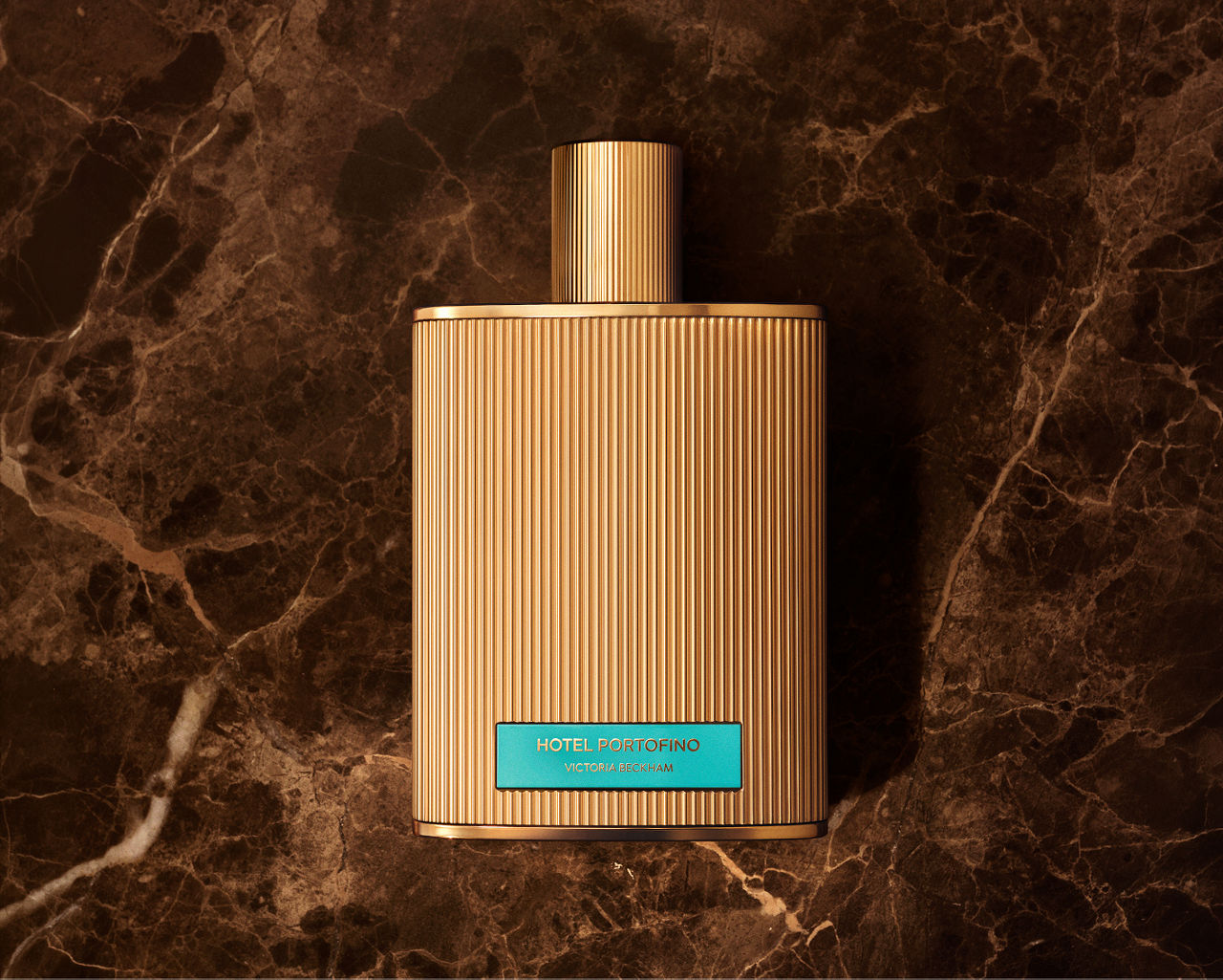 New from Victoria Beckham, Hotel Portofino extrait de parfum. An intense blend of bergamot, wild fig, pinot noir & black amber.