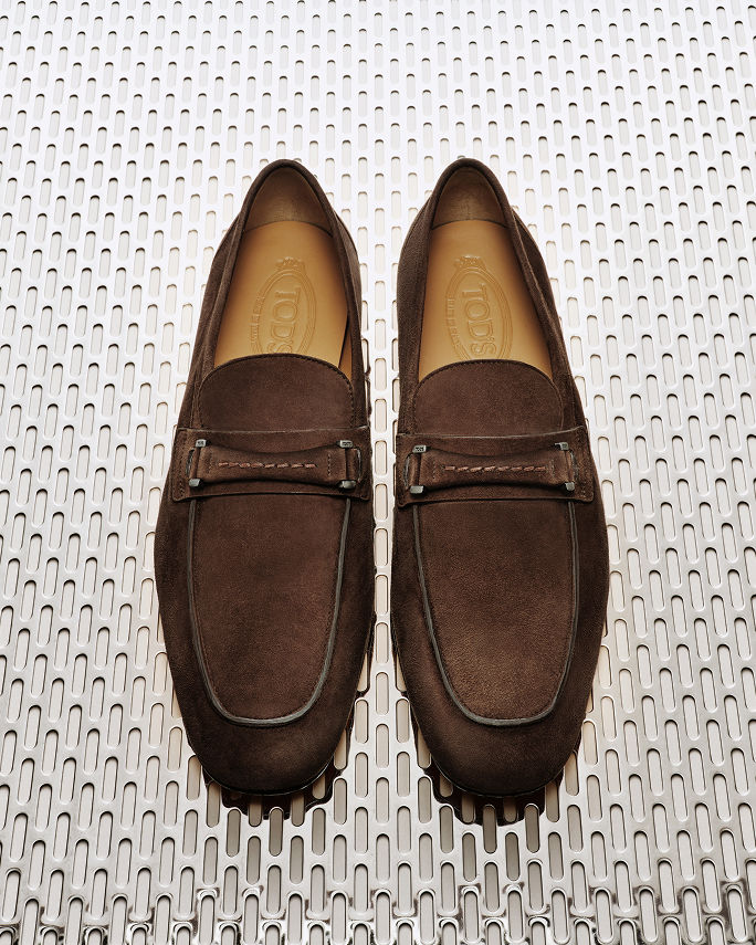 A pair of brown suede Tods loafers. Elevate the everyday. Shop shoes.