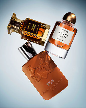 3 fragrance bottles in shades of orange. Featured shops, fragrance.