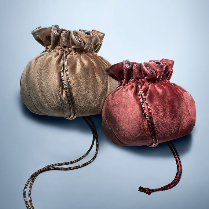 Our favorite free gifts. Ends November 11. Exclusive free travel pouch in rose or taupe with any beauty purchase of $150 or more.