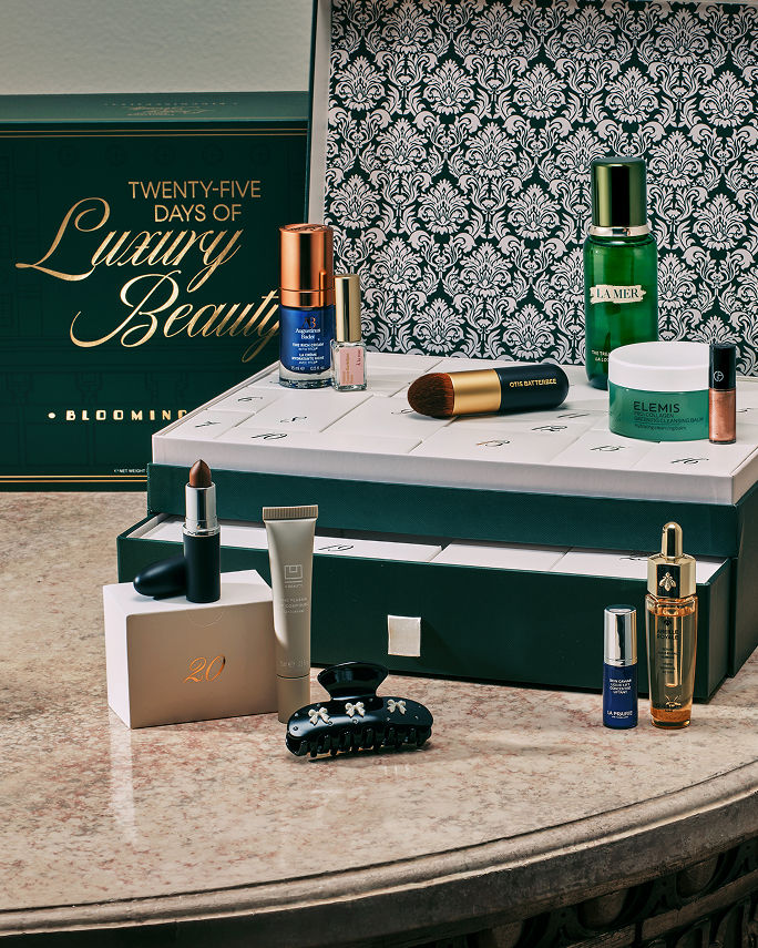 An opened Advent calendar box of beauty products. Our best beauty gifts, shop sets.