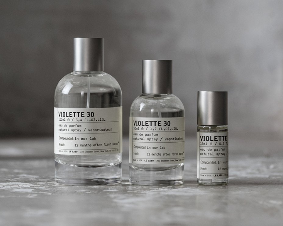 3 different size bottles of Le Labo Violette 30 lined in a row.