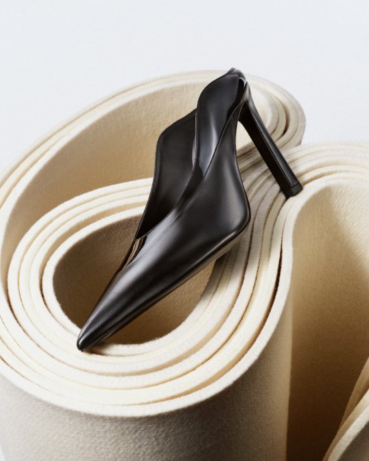 A single black sleek and structural Givenchy high heel mule.