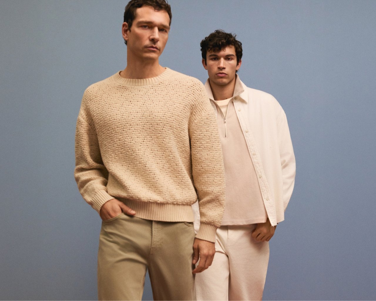 2 men in cream colored tops and pants. Shop refined minimalism.