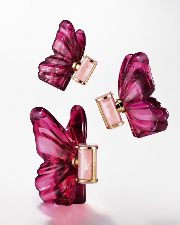 Pink Caroline Herrera perfume bottles shaped like butterflies. Shop Caroline Herrera.
