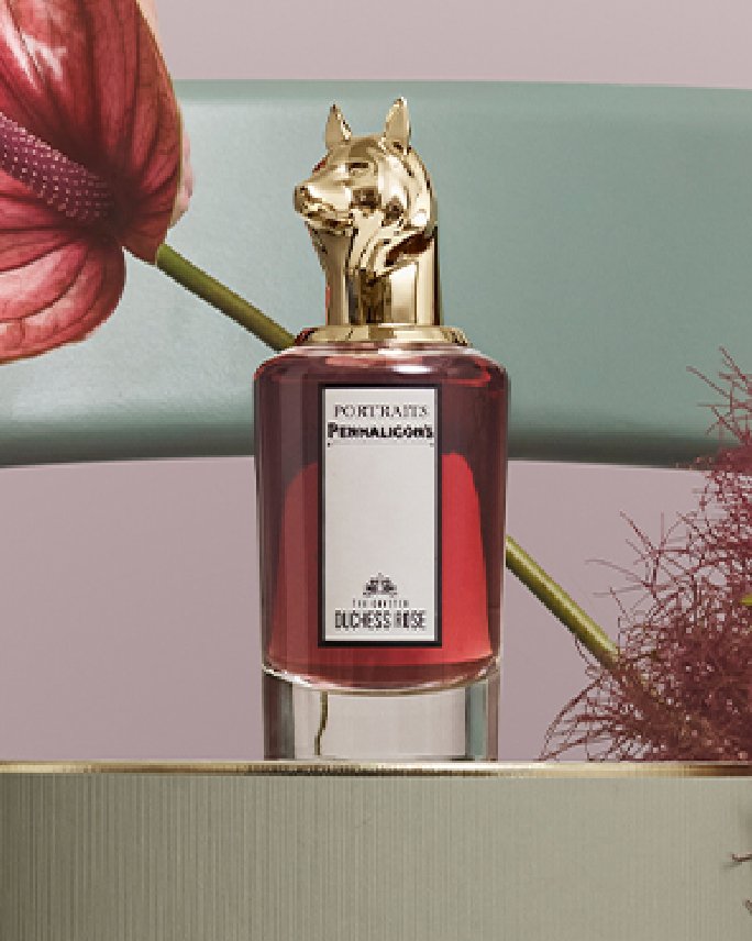 A red bottle of Penhaligons Coveted Duchess Rose fragrance. Shop Penhaligons.