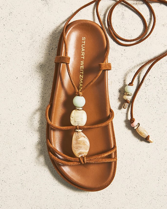 A Stuart Weitzman sandal with embellished stone tie. Beach bound, sandals.