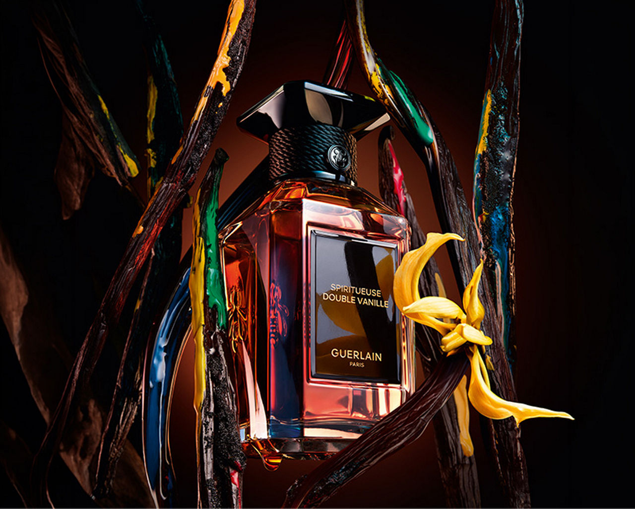 An amber bottle of Guerlain Spritueuse Double Vanille fragrance. Luxe fragrance, Guerlain.