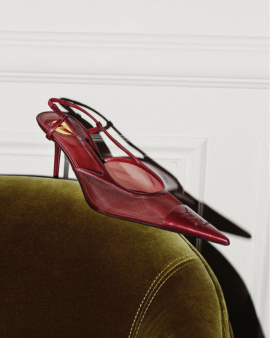 A single maroon mesh Saint Laurent stiletto. Shop shoes.