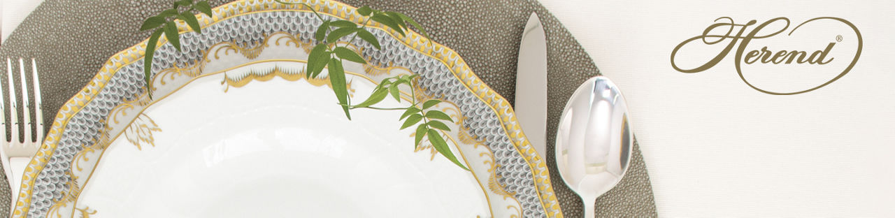 Herend. A closeup of a Herend dinner plate with a fish scale pattern on the edge.