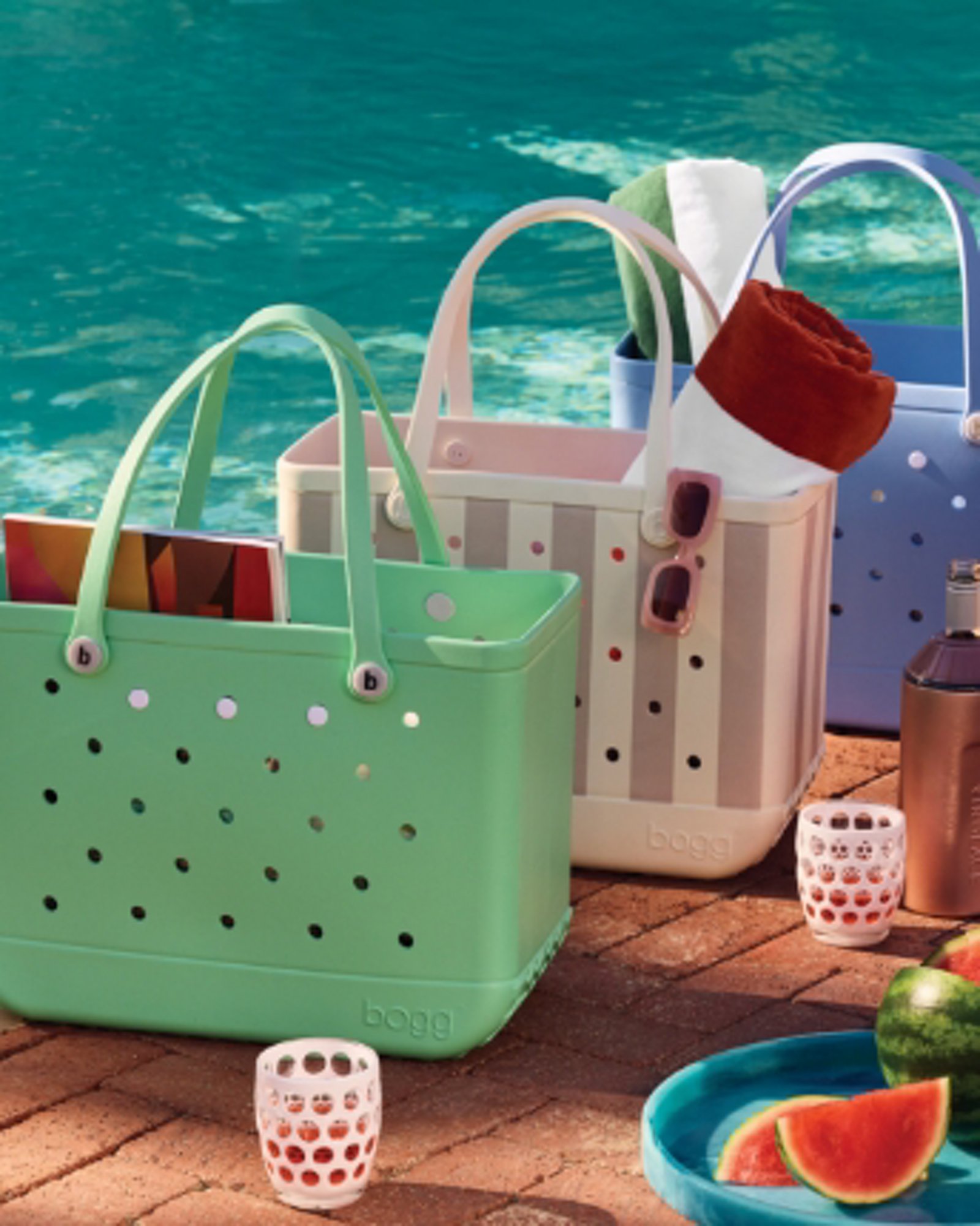 1 photo of 3 perforated Bogg bags in green, white and tan stripes, and blue.