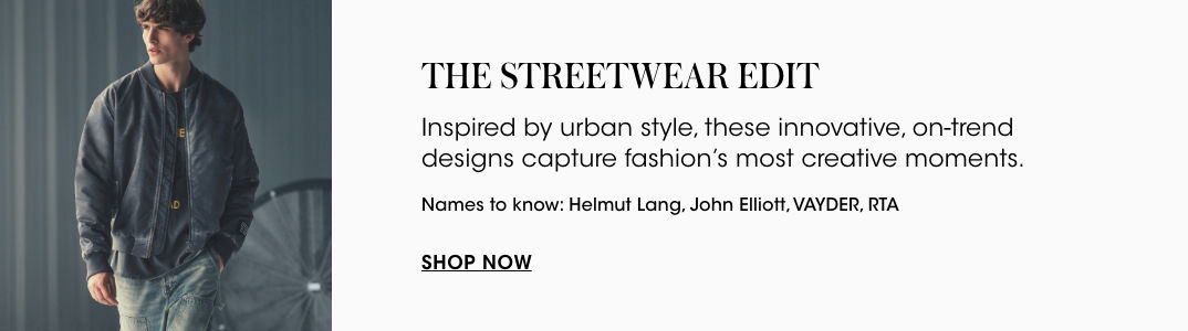 1 photo of 1 male model in light wash blue jeans, black tee shirt, and green light weight jacket.