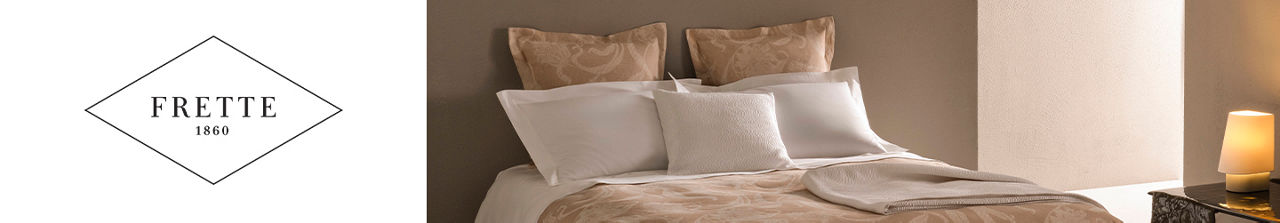 Frette 1860. A bed made up with Frette linens.