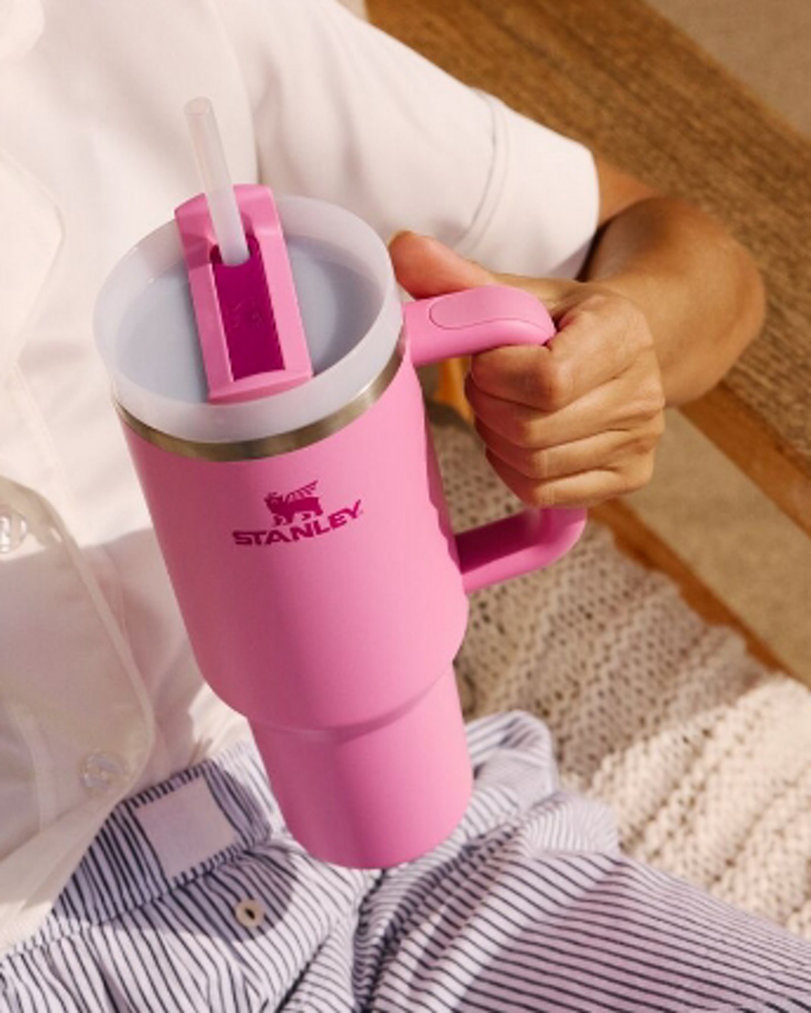 1 photo of a closeup of a pink Stanley cup with straw insert.