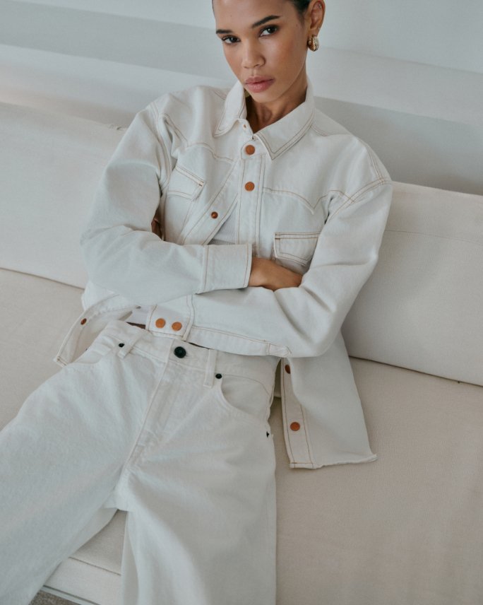 Woman in a Silver lake white denim jacket and jeans.