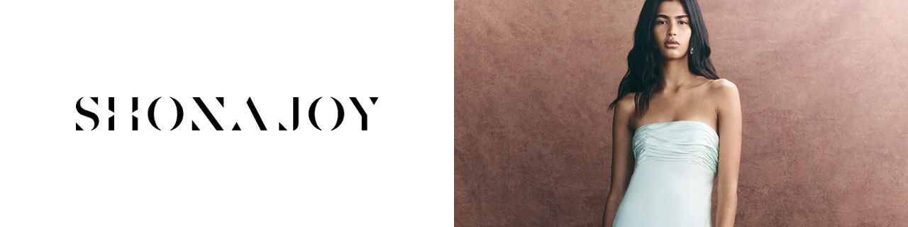 Shona Joy. A woman in a white Shona Joy strapless dress.