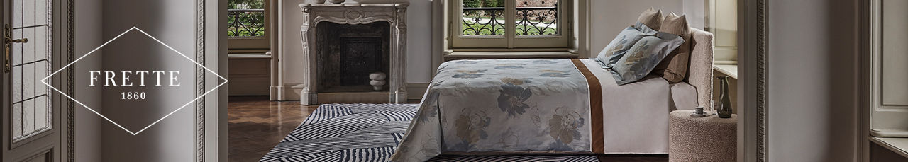 Frette 1860. A bed made up with Frette linens.